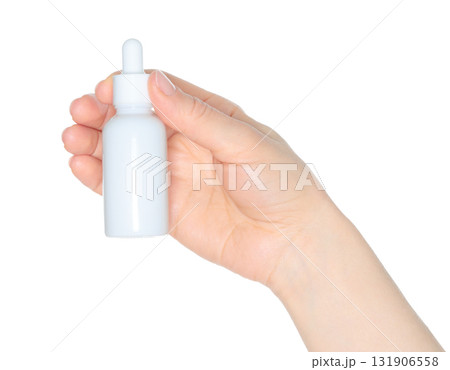Human hand holding white cosmetic bottle isolated on transparent background 131906558