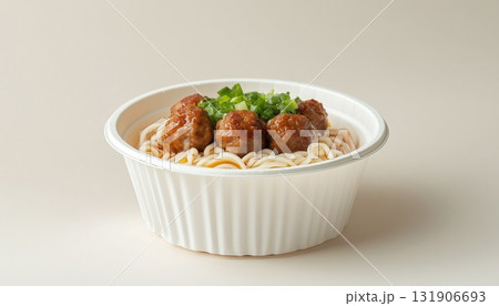 Noodle and meatballs on paper bowl street food with disposable container packaging white background 131906693