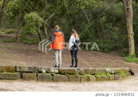 Young couple exploring nature on woodland hike Young couple exploring nature on woodland hike 131906852