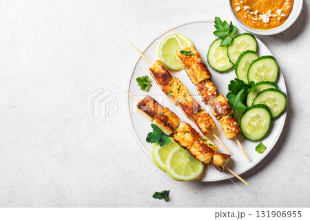 Grilled tofu satay skewers and peanut spicy sauce 131906955