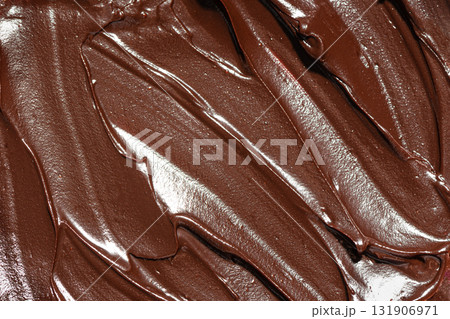 Rich melted chocolate sauce texture Rich melted chocolate sauce texture 131906971