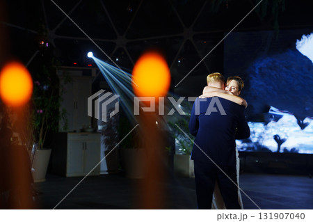 The bride and groom dance the first dance at the wedding banquet. The bride and groom dance the first dance at the wedding banquet. 131907040
