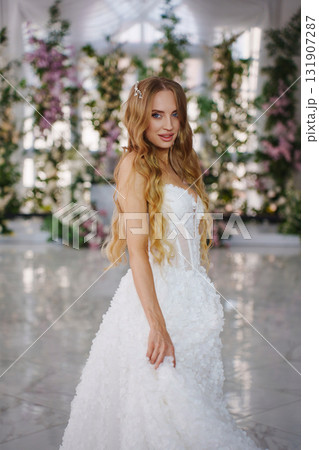 A bride in a hall decorated with flowers, decorated with flowers A bride in a hall decorated with flowers, decorated with flowers 131907287