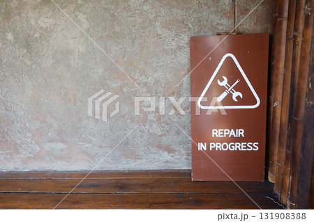 Repair in progress wooden sign 131908388