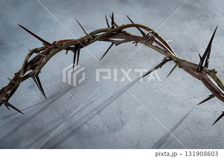Jesus Crown of thorns shadow silhouette against textured gray surface, symbol spiritual pain and redemptive struggle Banner good friday concept Easter Christian background, 131908603