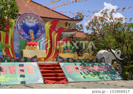 Buddhist Chua Tu Van Pagoda decorated for the holiday among flowering trees Buddhist Chua Tu Van Pagoda decorated for the holiday among flowering trees 131908917