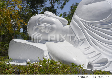 A fragment of the big sculpture of sleeping Buddha near the Chua Tu Van Pagoda A fragment of the big sculpture of sleeping Buddha near the Chua Tu Van Pagoda 131908927