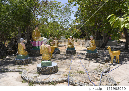 Gilded sculptures of Buddha, his disciples and deer in the garden near the Chua Tu Van Pagoda 131908930