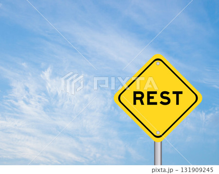 Yellow transportation sign with word rest on blue color sky background Yellow transportation sign with word rest on blue color sky background 131909245