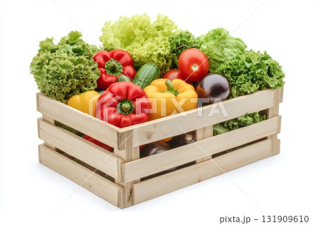 Fresh vegetables in wooden box. Healthy food on natural farm background. Harvested vegetables in a wooden crate on transparent background. Fruits and veggies. Organic produce and lush greenery. 131909610