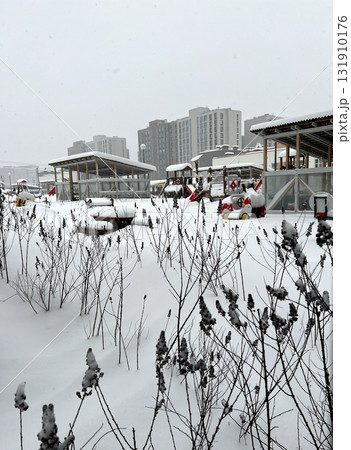 The kindergarten playground is covered in snow. An uncleared playground in winter. 131910176