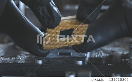 Computer Repairman Holds A Pc Processor Before Replacement 131910865