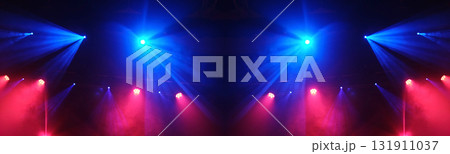 Stage Light Illuminates The Concert Stage With Smoke During A Musical Performance 131911037