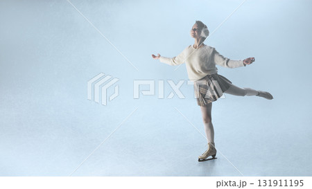 Elegant woman ice skater in plaid skirt performing graceful pose under soft snowy light Elegant woman ice skater in plaid skirt performing graceful pose under soft snowy light 131911195