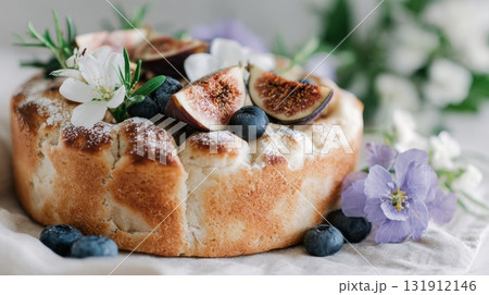 Sweet focaccia topped with figs and fresh flowers makes a beautiful and tasty homemade dessert perfect for autumn gatherings Sweet focaccia topped with figs and fresh flowers makes a beautiful and tasty homemade dessert perfect for autumn gatherings 131912146