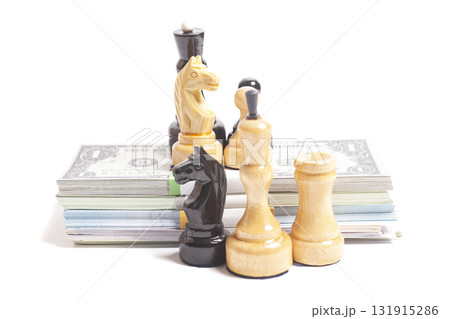 Chess with stack of money Chess with stack of money 131915286