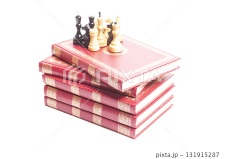 Chess on stack of books Chess on stack of books 131915287