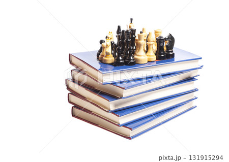 Chess on stack of books Chess on stack of books 131915294
