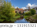 Salisbury, Wiltshire, UK: The River Avon in central Salisbury seen from Fisherton Street with St Thomas's Church in the background. 131915321