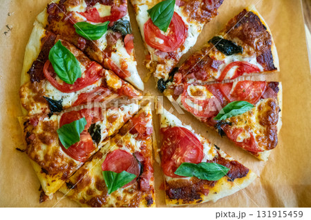 Pizza, slices, fresh. Delicious homemade pizza slices with vibrant tomatoes, mozzarella, and fragrant basil, ready to eat. Pizza, slices, fresh. Delicious homemade pizza slices with vibrant tomatoes, mozzarella, and fragrant basil, ready to eat. 131915459