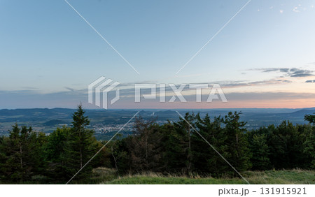 Panoramic view of valley town with mountains at sunset 131915921