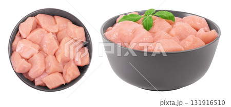 Raw diced chicken fillet in ceramic bowl isolated on white background. Top view. Flat lay Raw diced chicken fillet in ceramic bowl isolated on white background. Top view. Flat lay 131916510