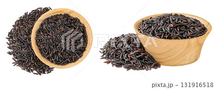 Black wild rice in wooden bowl isolated on white background close up. Top view. Flat lay Black wild rice in wooden bowl isolated on white background close up. Top view. Flat lay 131916518