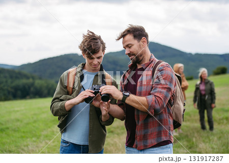 Father spending weekend with son on hike in nature. 131917287