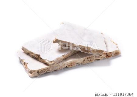 Delicious almond nougat on wooden table. Traditional Christmas sweet 131917364