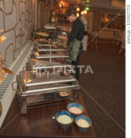 Selective focus. Row of Chafing Dishes at Event Buffet Selective focus. Row of Chafing Dishes at Event Buffet 131917713