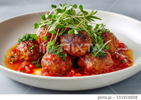 Italian meatballs with tomato sauce and fresh herbs 131918808