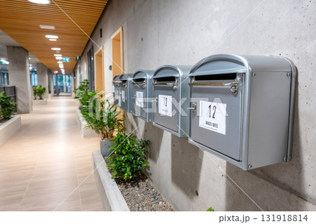 Row of mailboxes on concrete wall inside modern apartment building Row of mailboxes on concrete wall inside modern apartment building 131918814