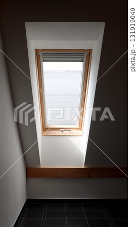 Modern skylight illuminating a clean interior space with soft light 131919049