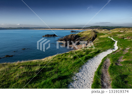 Island Ynys Llanddwyn At Newborough Beach With Newborough Conifer Forest At The Atlantic Coast Of North Wales, United Kingdom Island Ynys Llanddwyn At Newborough Beach With Newborough Conifer Forest At The Atlantic Coast Of North Wales, United Kingdom 131919374