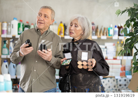 Couple man and woman choosing perfume and cosmetics Couple man and woman choosing perfume and cosmetics 131919619