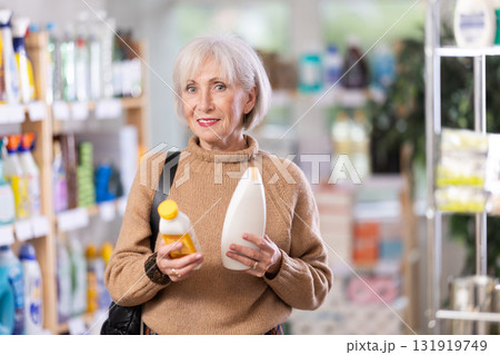 woman chooses hair care products woman chooses hair care products 131919749