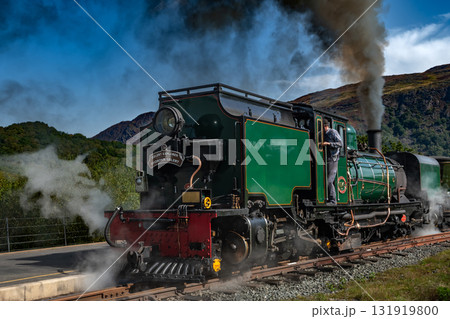 Old Train With Steam Locomotive At Beddgelert Train Station In Snowdonia National Park In Wales, United Kingdom Old Train With Steam Locomotive At Beddgelert Train Station In Snowdonia National Park In Wales, United Kingdom 131919800
