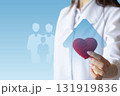 Healthcare professional promotes family wellness with heart symbol. 131919836