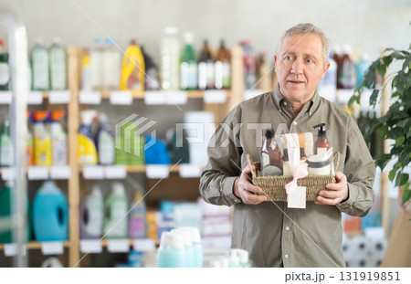 Elderly man choosing a bath gift set Elderly man choosing a bath gift set 131919851