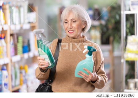 Elderly woman choosing spray in store 131919866