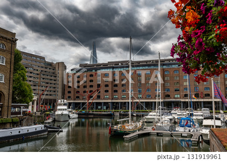 Boats And Ships In St Katharine Docks With Office Buildings And Restaurants In London, United Kingdom 131919961