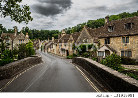 Picturesque Village Castle Combe In The Cotswolds Area In Wiltshire In England, United Kingdom Picturesque Village Castle Combe In The Cotswolds Area In Wiltshire In England, United Kingdom 131919981