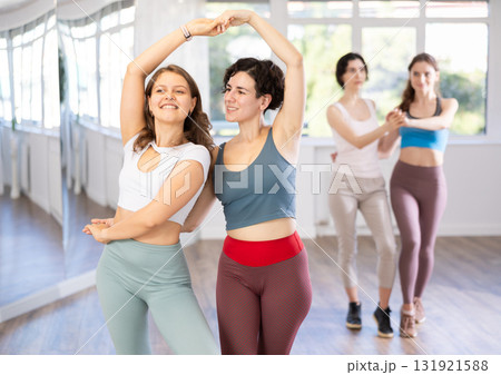 Group of women dancing pair dances in studio Group of women dancing pair dances in studio 131921588