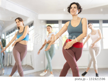 Funk jazz dancers practicing dance moves in studio 131921596
