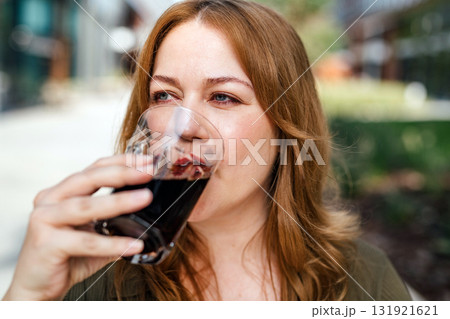 Plus size woman drinking soft soda drink outdoors. Plus size woman drinking soft soda drink outdoors. 131921621