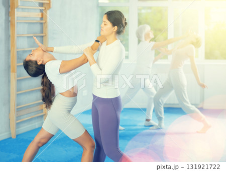 Two young women training self-defense techniques 131921722