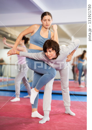 Women practice self-defense techniques in pairs Women practice self-defense techniques in pairs 131921780