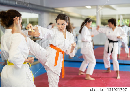 Women in kimonos do karate Women in kimonos do karate 131921797