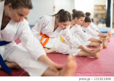 Women do stretching during training 131921806