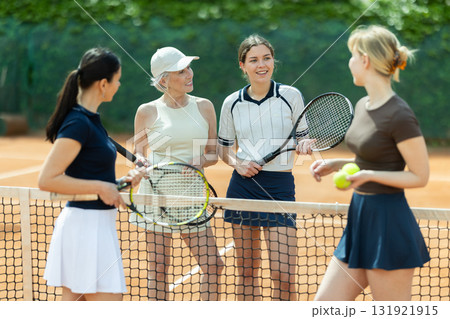 Tennis match female participants chat after game Tennis match female participants chat after game 131921915